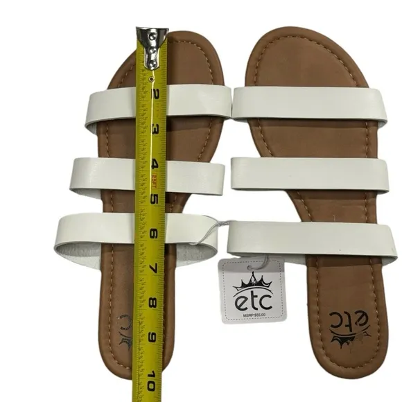 Etcetera size 8/9 NWT slide on style sandals. Tan with white straps along top.